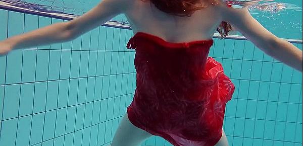  Red Dressed teen swimming with her eyes opened